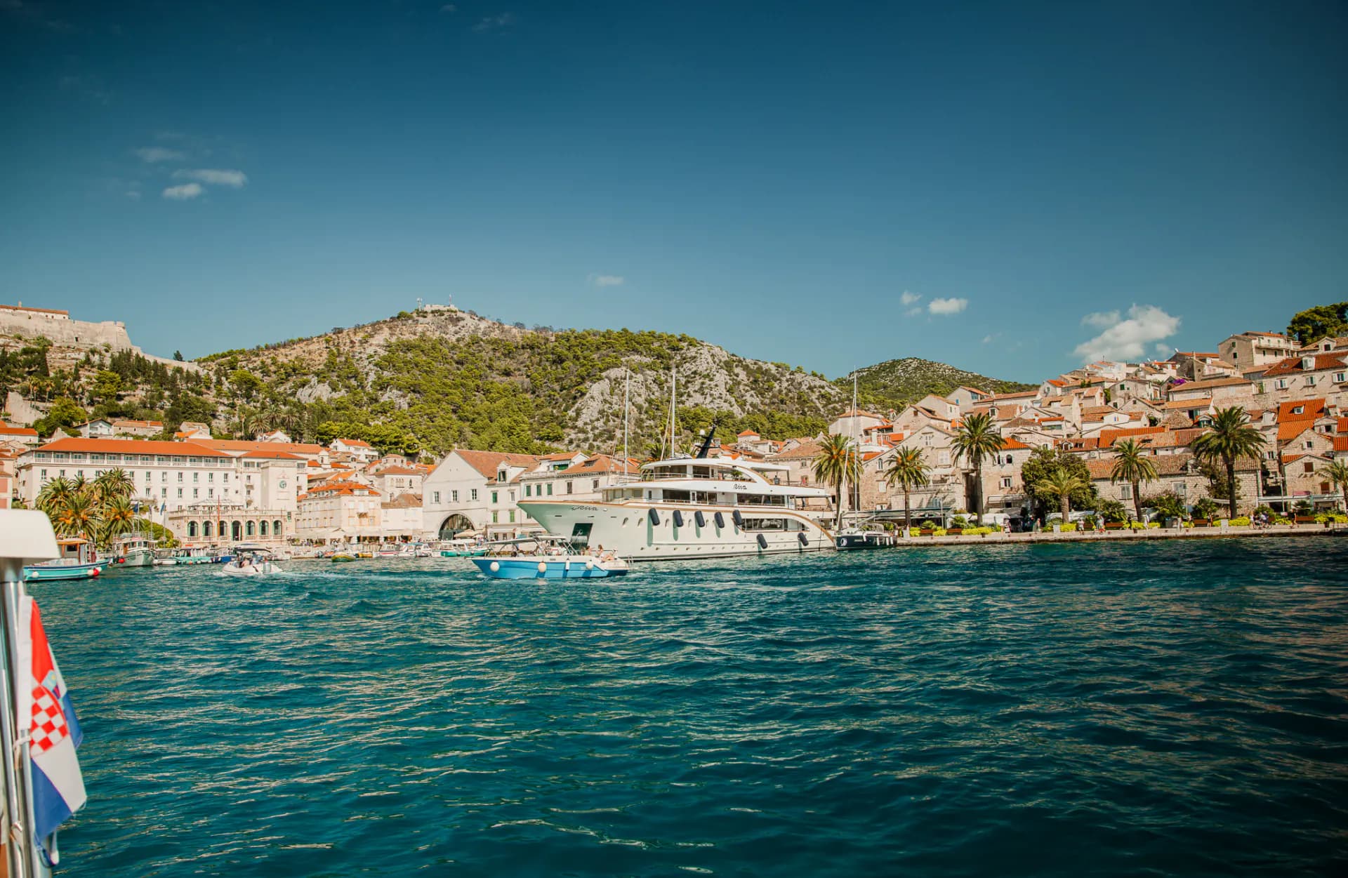 Hvar town and its waterfront seen from the water on the way in. Blue Cave Group Tour